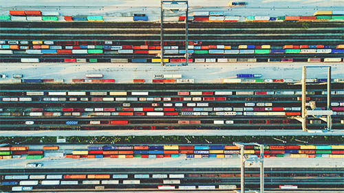 Intermodal containers in rail yard.